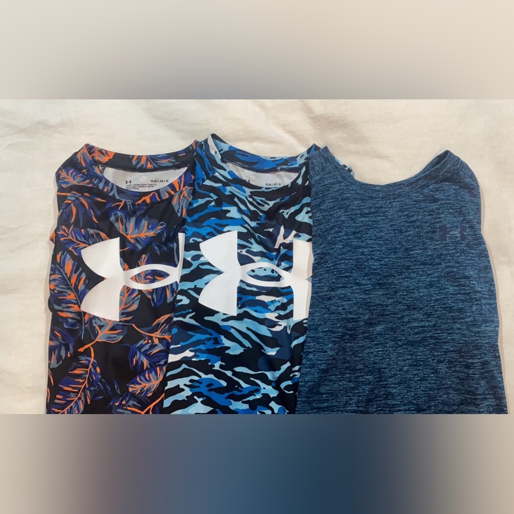Three Under Armor dry fit shirts. Youth Large New without tags